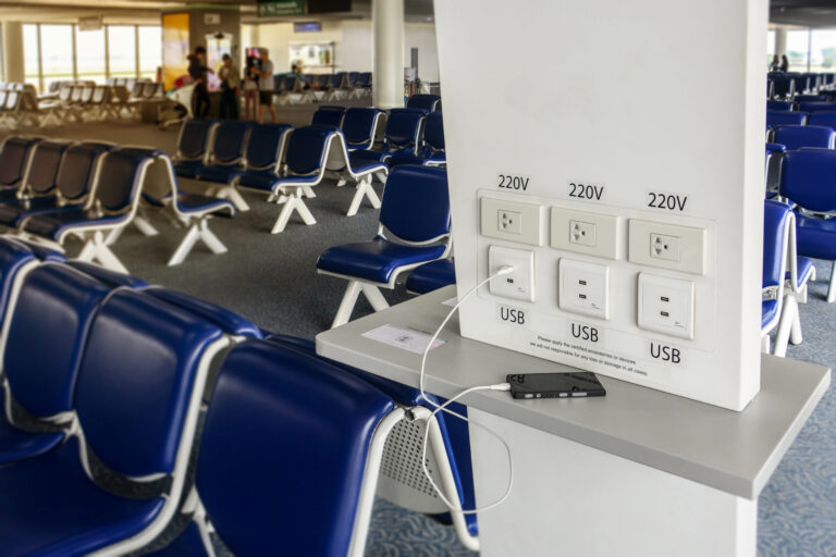 Mobile device charging station at the airport